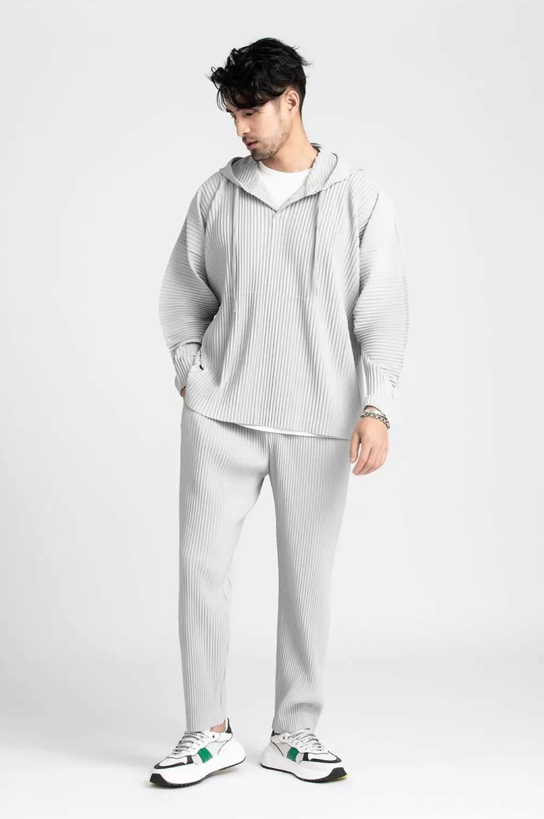 Light grey Glacier Wave pleated hoodie and trouser set shown from the side with a comfortable relaxed fit and monochrome styling