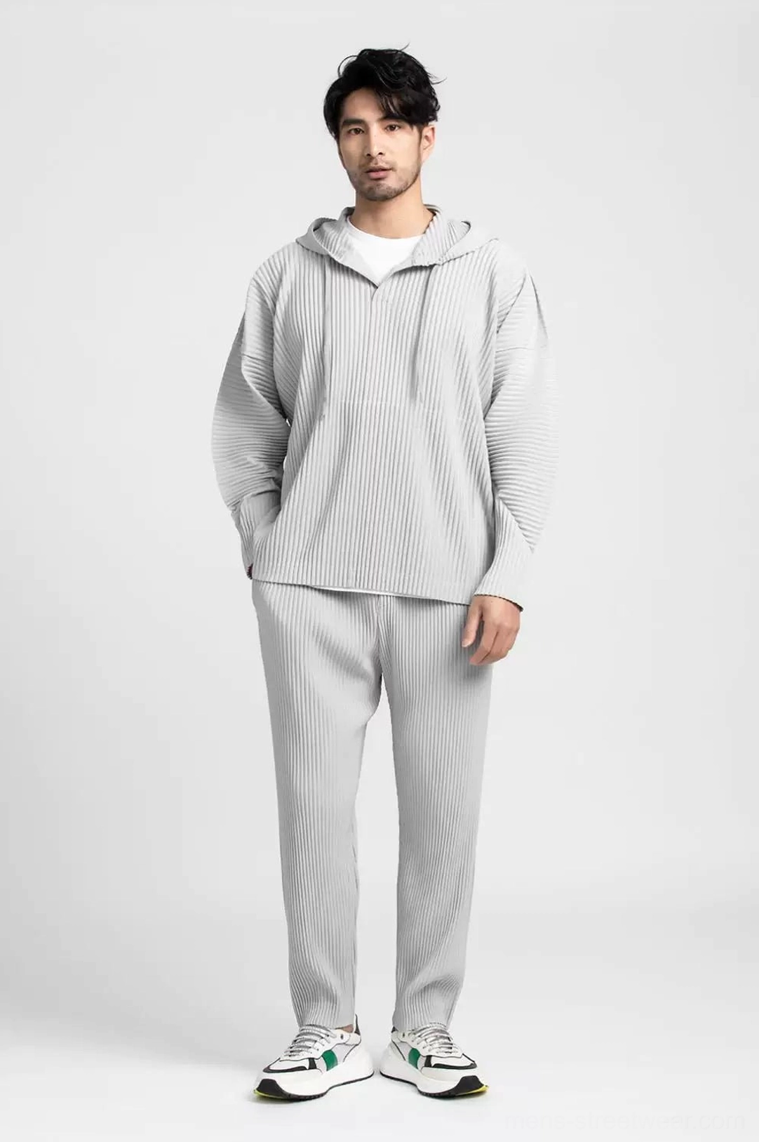 Full-length front view of a men's light grey pleated loungewear set with oversized hoodie, straight-leg pants, and Korean streetwear styling