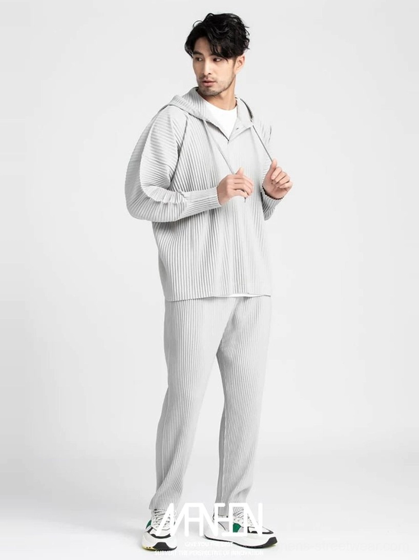 Men's light grey Glacier Wave pleated hoodie and sweatpants set shown in a full-length front view with vertical texture and relaxed Korean streetwear fit