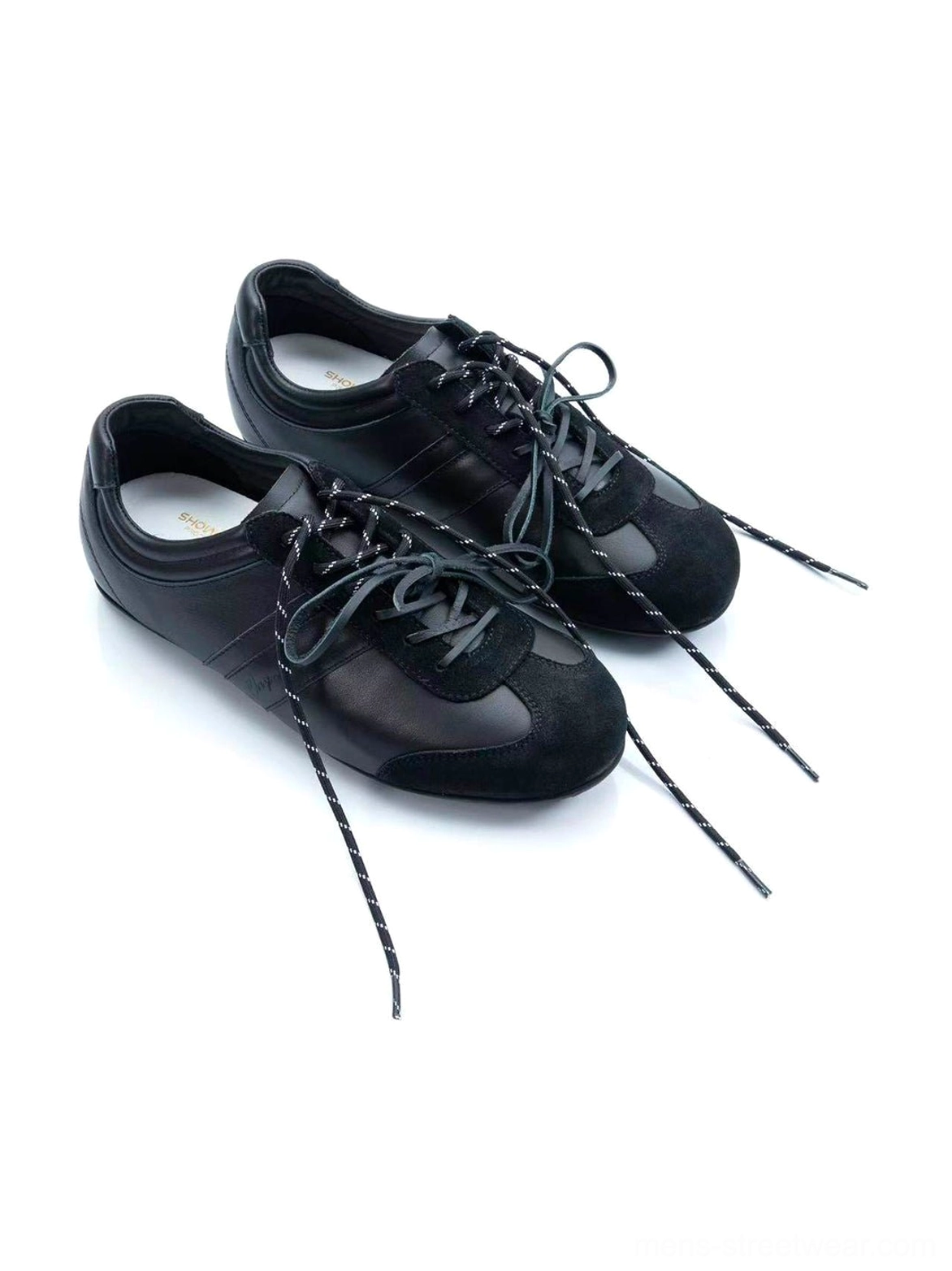 Gloss-finish suede leather low-profile retro trainers product detail view highlighting the sleek streetwear silhouette
