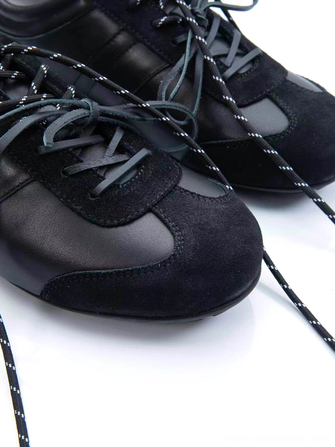 Gloss-finish suede leather low-profile retro trainers highlighting the slim flat retro outsole