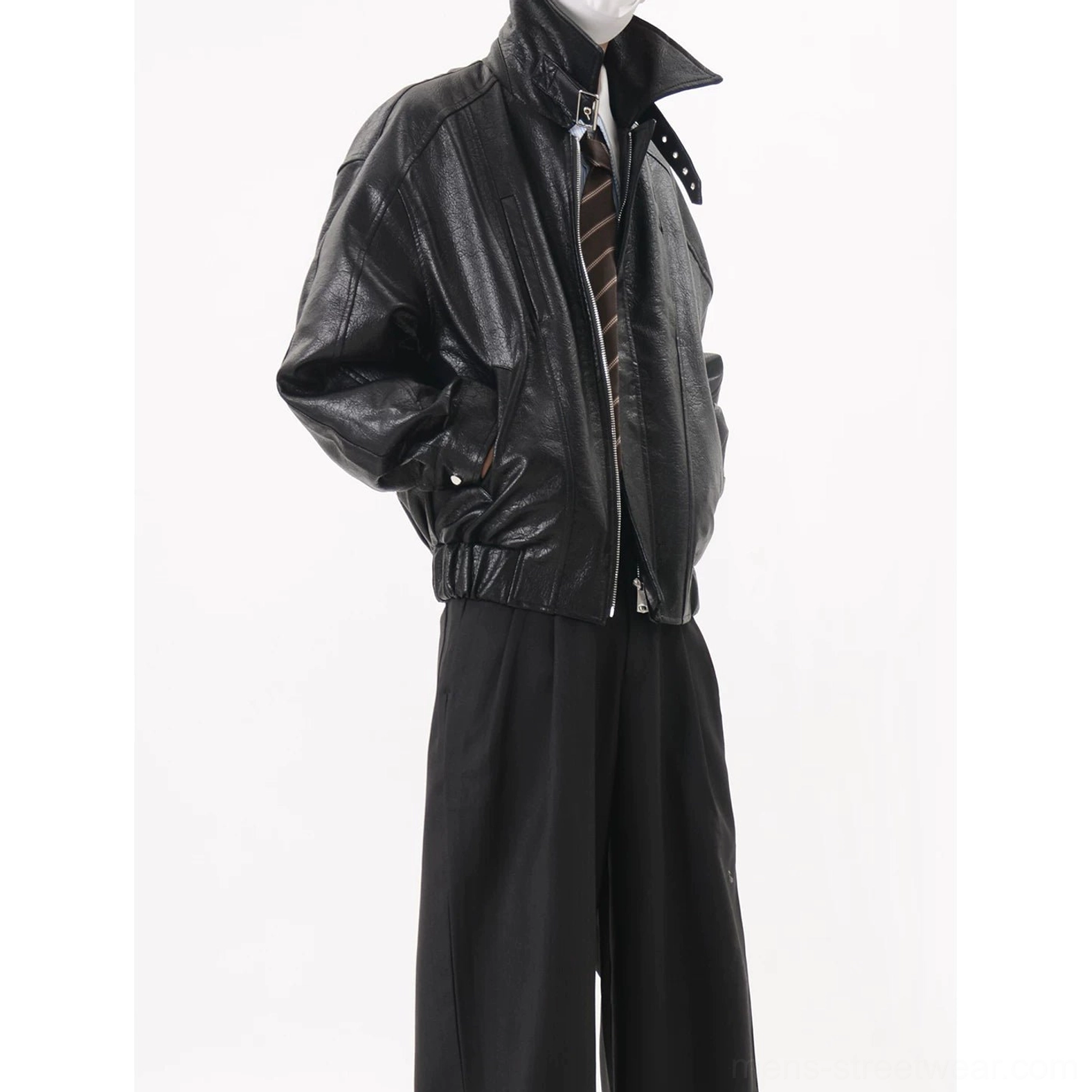 Glossy black oversized faux leather bomber jacket with adjustable buckle stand collar front zipper side pockets and dropped shoulders