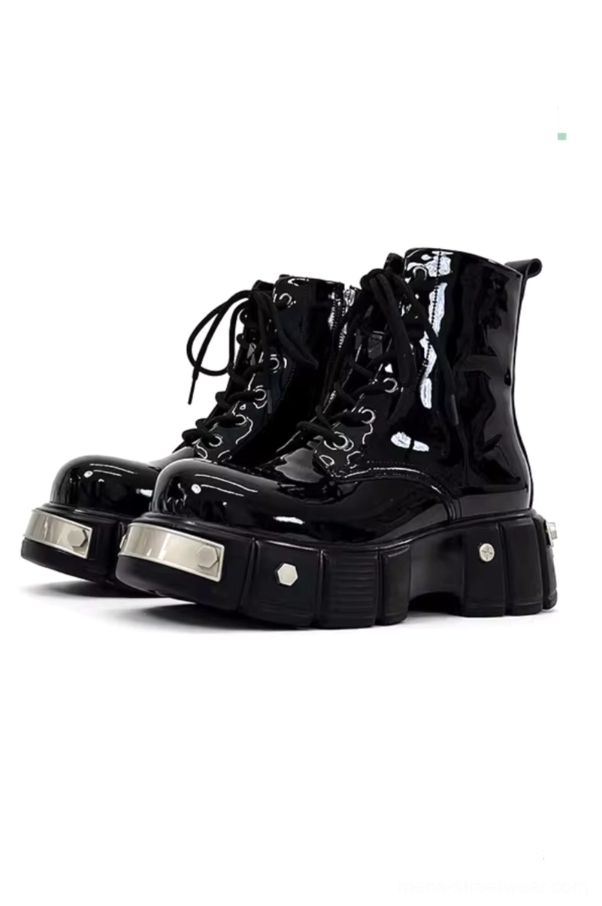 Glossy black patent leather platform combat boots with silver metal toe caps, hexagonal rivets, lace-up closure, and chunky lug sole on white background