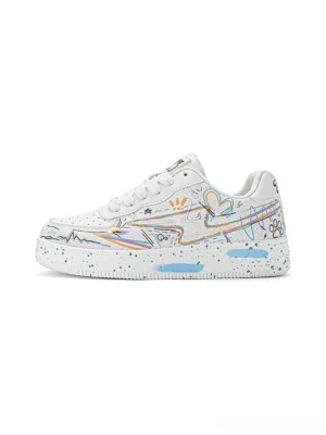 Side profile of white graffiti lightning low-top court sneakers with colorful line art, heart graphics, and a speckled streetwear outsole