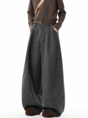Dark gray granite cocoon super wide pleated trousers front low angle view with tailored waistband and balloon leg silhouette