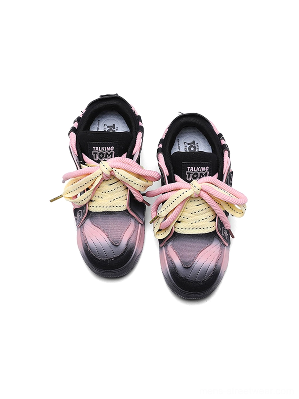 Top-down view inside graphic pink-trim chunky sneakers showing printed insoles, colorful laces, and gradient toe caps