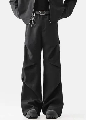 Gray avant-garde wide-leg utility pants with high waist, sculptural front pleats, and oversized Korean streetwear silhouette