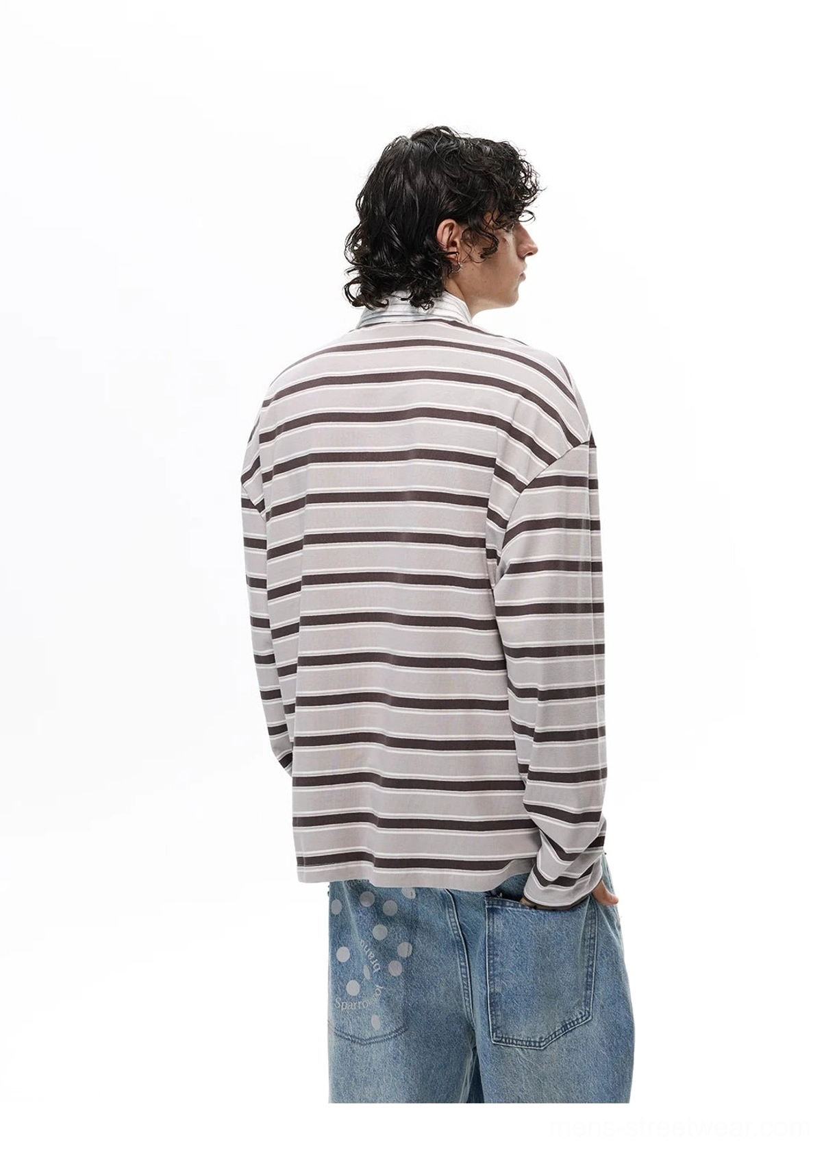 Gray and brown oversized striped rugby shirt shown from the back with loose long sleeves and all-over horizontal stripe pattern