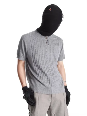 Three-quarter side view of gray short sleeve cable knit Henley sweater tee with button placket and slim fit