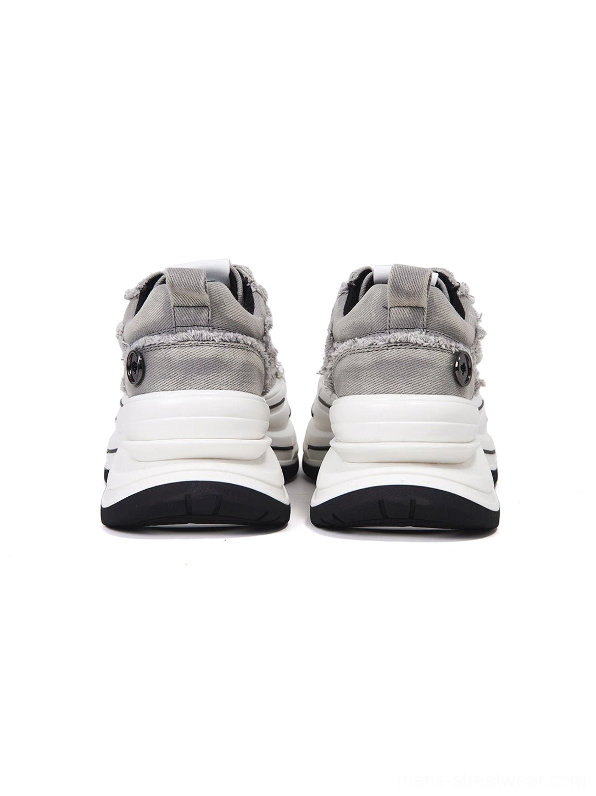 Rear view of a pair of gray canvas platform sneakers showing the layered 7 cm white midsole, structured heel panels, and contemporary unisex streetwear silhouette