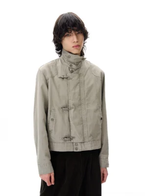 Gray cropped cotton utility jacket with metal toggle closures and adjustable waist belt front studio view