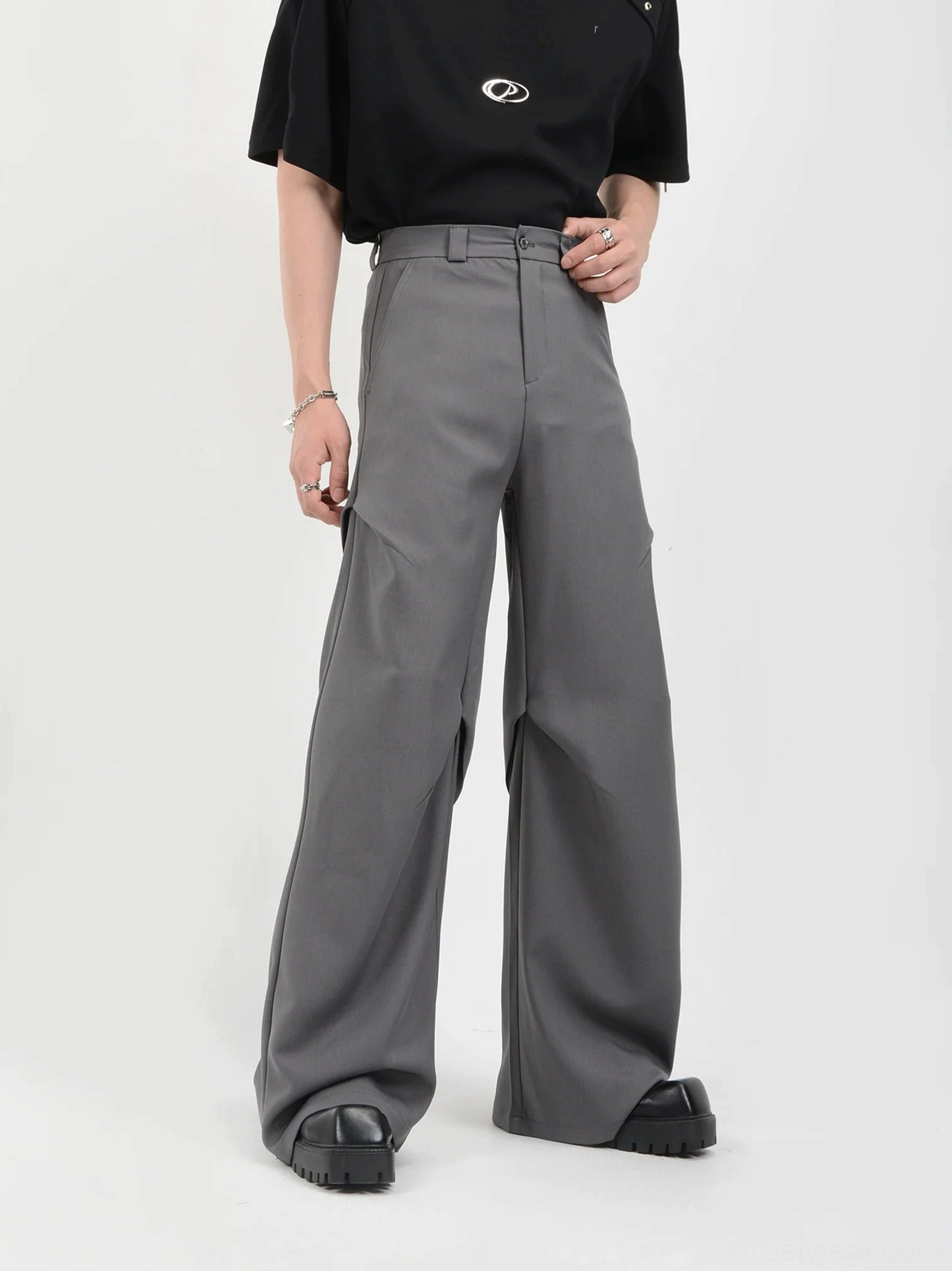 Gray drape wide-leg tailored trousers three-quarter view showing front pleat and fluid leg silhouette