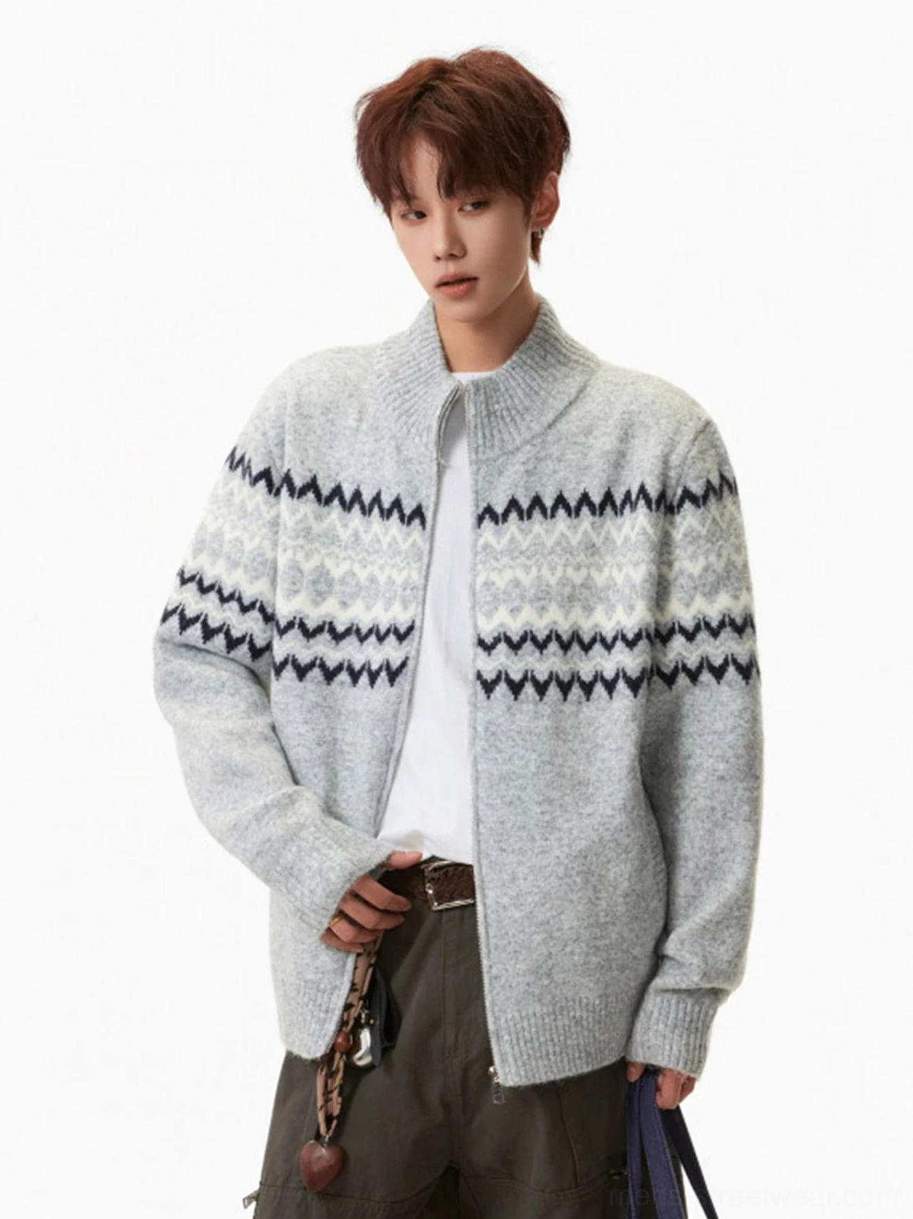 Men's gray full-zip Fair Isle cardigan side view highlighting the navy and off-white geometric chest and sleeve pattern