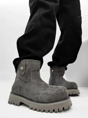 Gray fleece-lined suede work boots shown from the side with rounded toe and thick rubber lug outsole