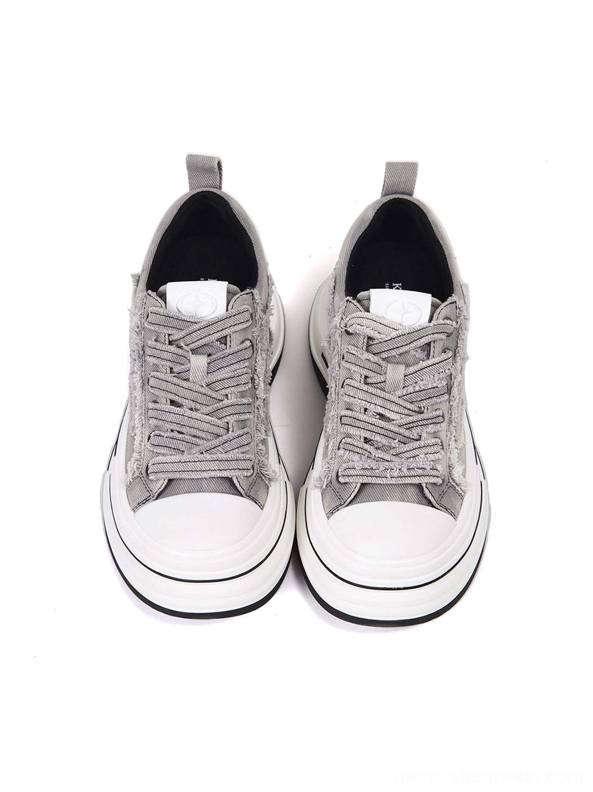 Front view of gray frayed canvas platform sneakers with classic round white rubber toe caps, textured laces, and neat canvas upper construction