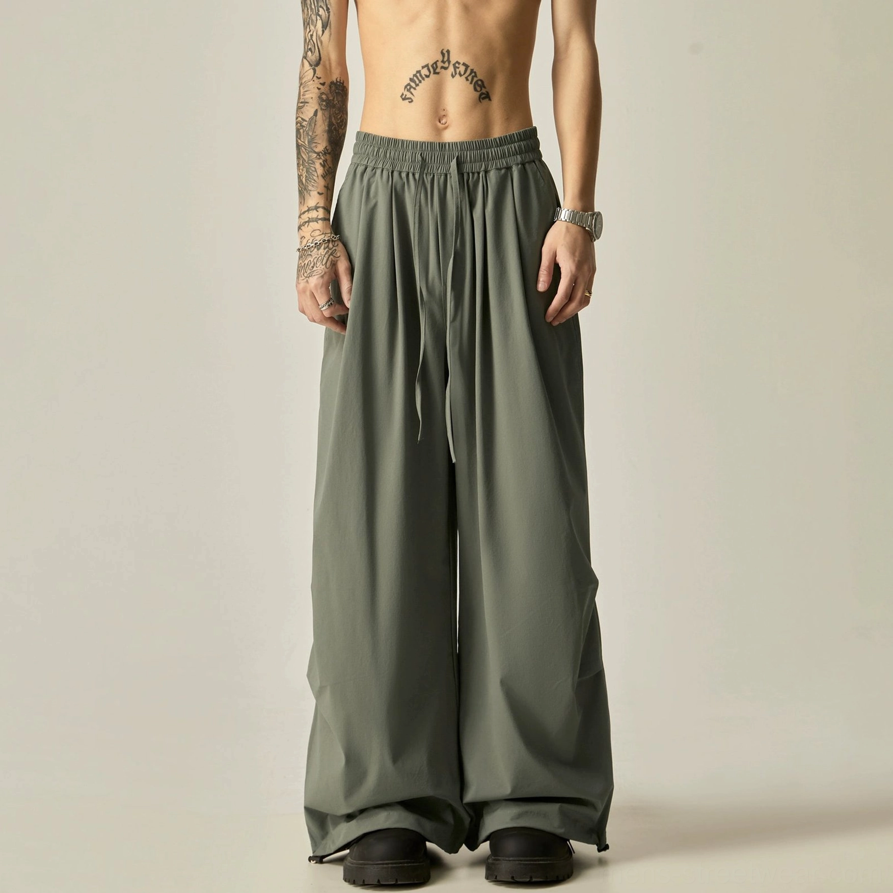 Gray green wide leg drawstring pants men's streetwear trousers with a flowy relaxed fit and adjustable ankle cuffs