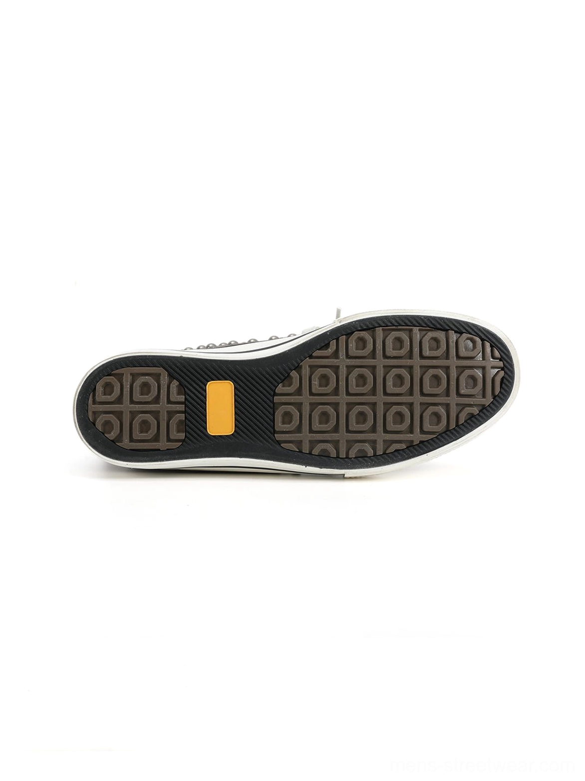Bottom view of gray high-top streetwear sneakers showing square-grid anti-slip outsole tread and contrasting yellow rubber accent block