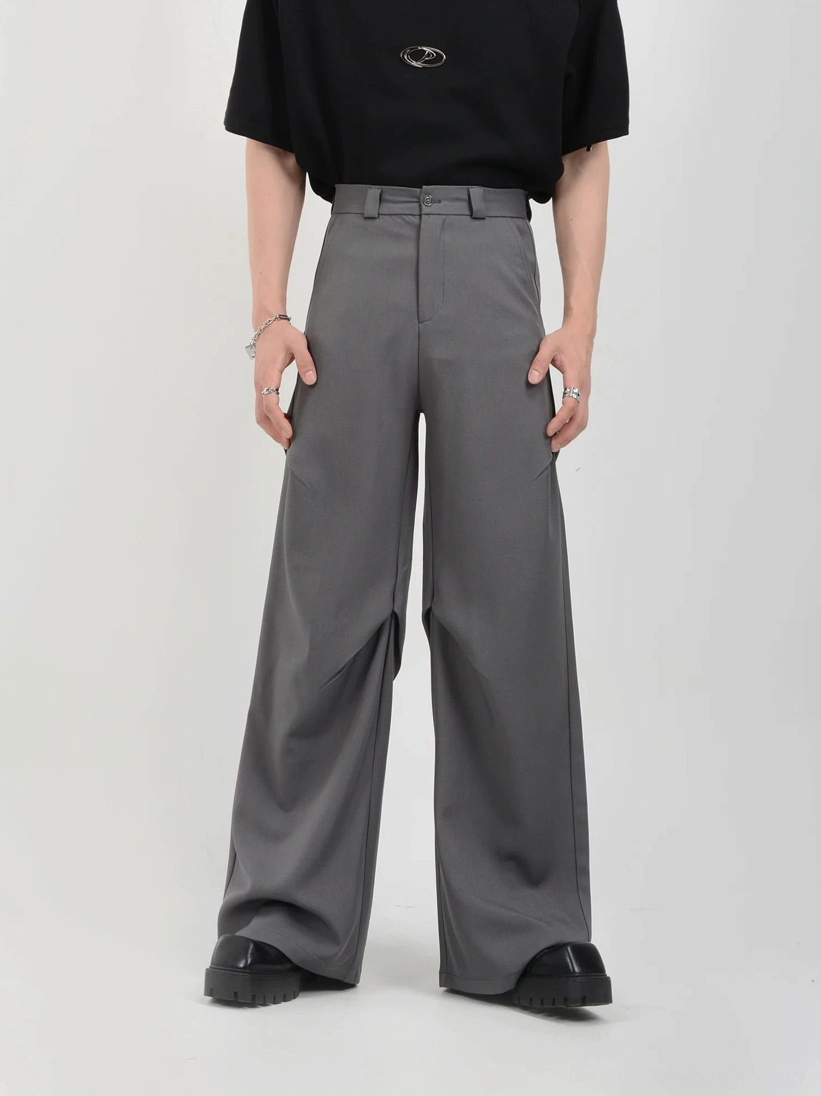 Gray high-waisted drape wide-leg tailored trousers front full-body view in minimalist streetwear style