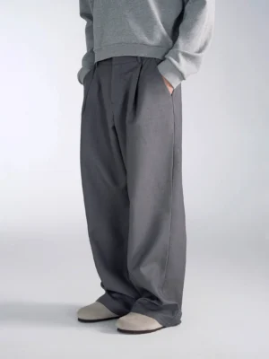 Gray high-waisted wide-leg suit trousers with front pleats and extra-long draped hem for men