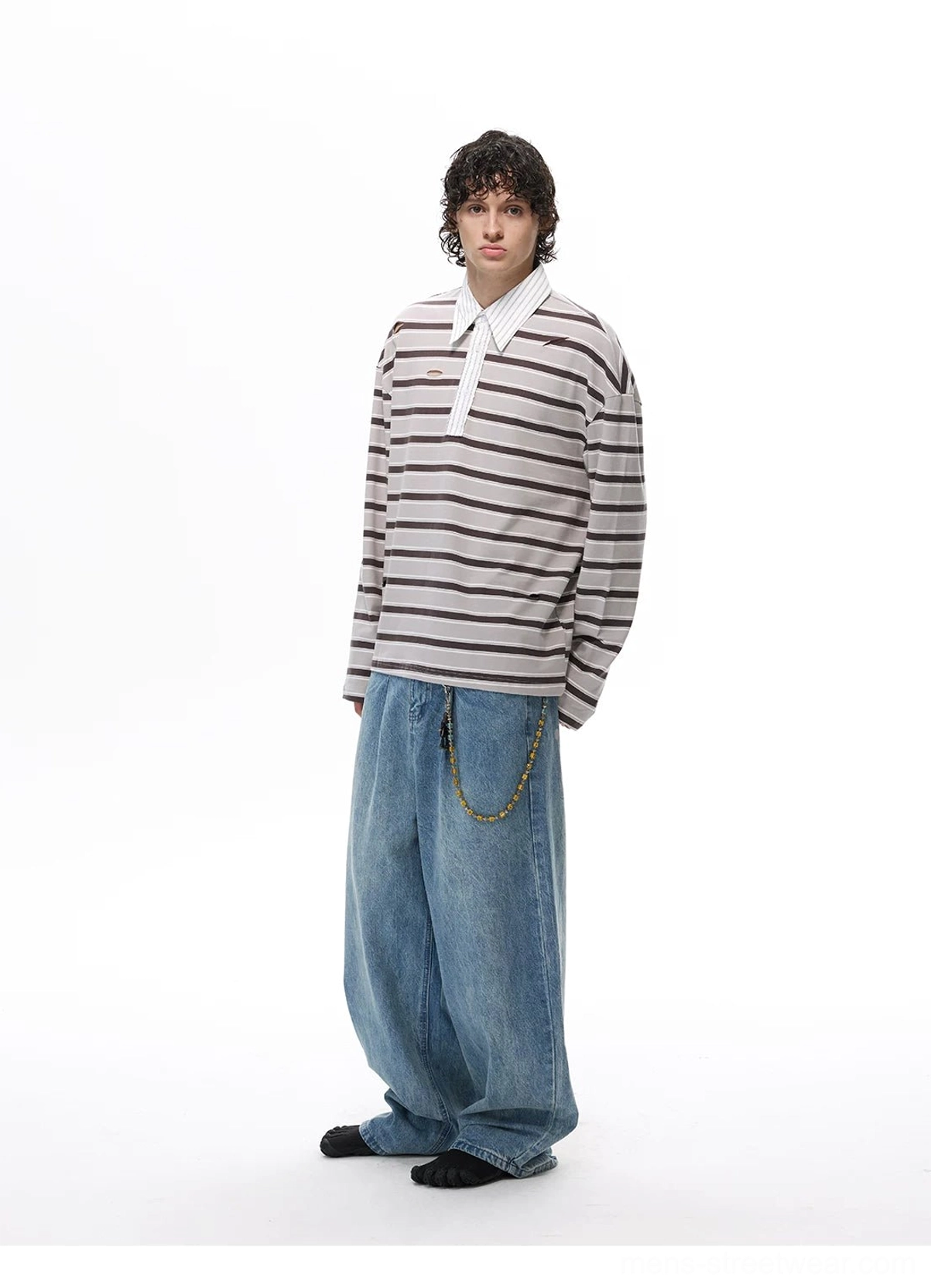 Gray horizontal striped oversized rugby shirt with long sleeves, contrast collar, and relaxed fit styled with wide baggy jeans