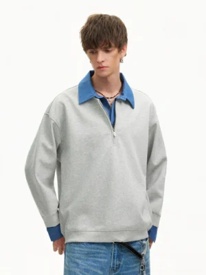 Heather gray layered collar quarter-zip sweatshirt with blue denim-look collar and cuffs in relaxed streetwear fit