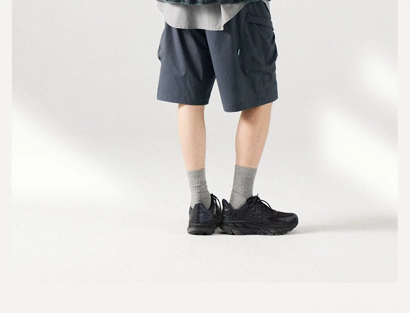 Gray navy men's cargo shorts with a functional loose silhouette, weather-ready fabric, and contemporary everyday streetwear appeal