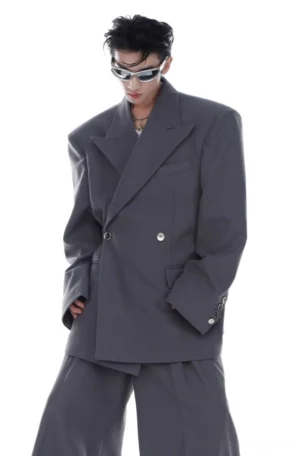 Gray oversized double-breasted blazer styled with wide-leg trousers in a minimalist Seoul streetwear studio look