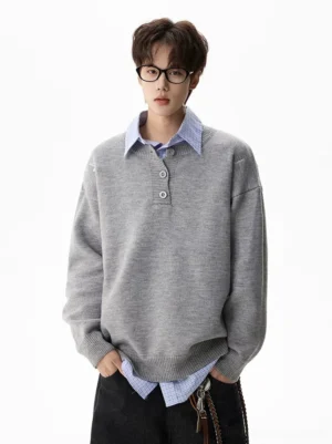 Full front view of a heather gray oversized henley knit sweater with drop shoulders, three-button placket, and relaxed Korean streetwear fit