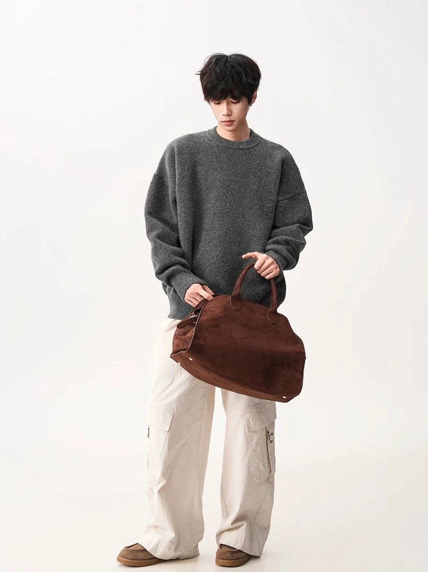 Heather gray oversized knit sweater styled with off-white cargo pants and a brown suede tote for Acubi-inspired Korean street fashion