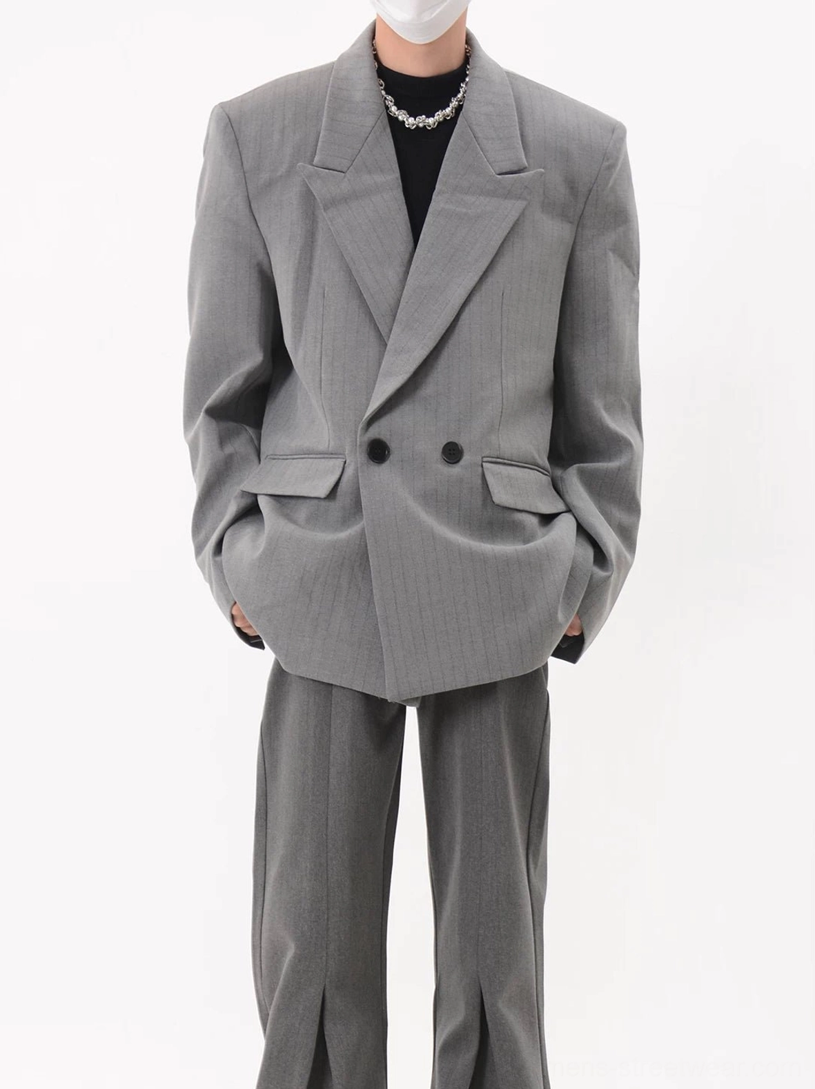 Gray oversized pinstripe double-breasted blazer styled with a black turtleneck and wide-leg trousers in a Seoul streetwear outfit