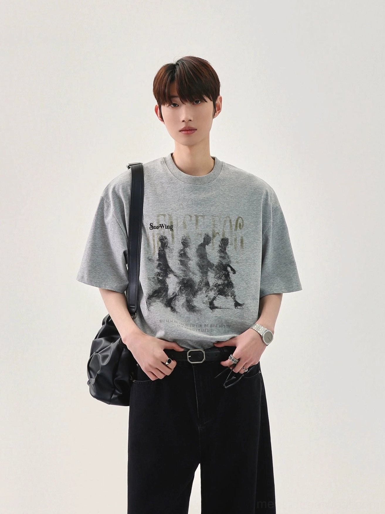 Heather gray oversized graphic T-shirt featuring a blurred retro marching figure print, relaxed crew neck, and Korean streetwear crossbody styling