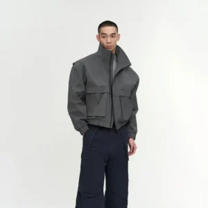 Men's gray padded stand-collar utility jacket with relaxed boxy cropped fit and front flap pockets in modern Korean streetwear style