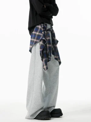 Gray plaid shirt layered wide-leg jogger pants rear side view with heather sweatpants and blue brown tartan waist overlay