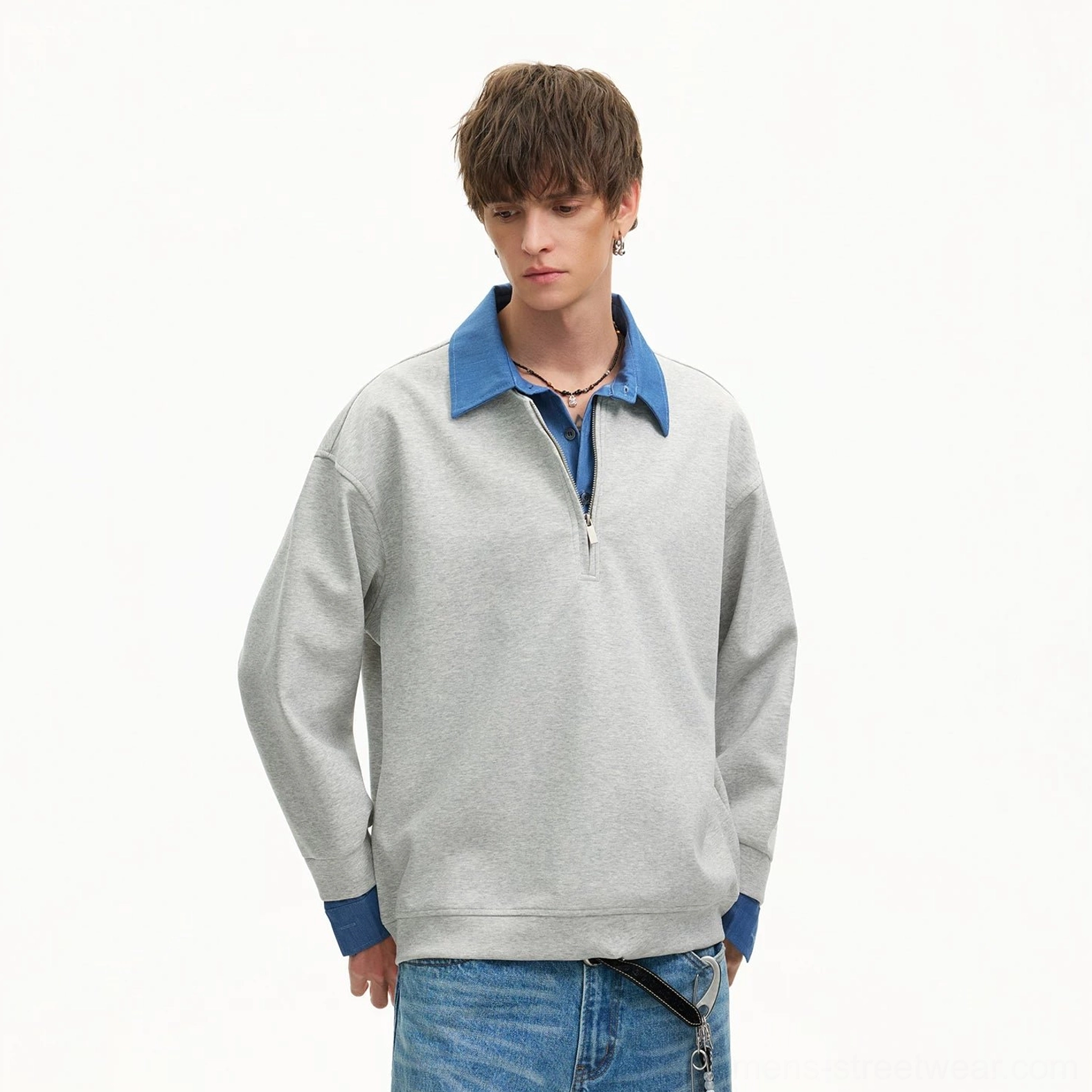 Heather gray quarter-zip sweatshirt with blue layered collar and cuffs styled with layered necklaces