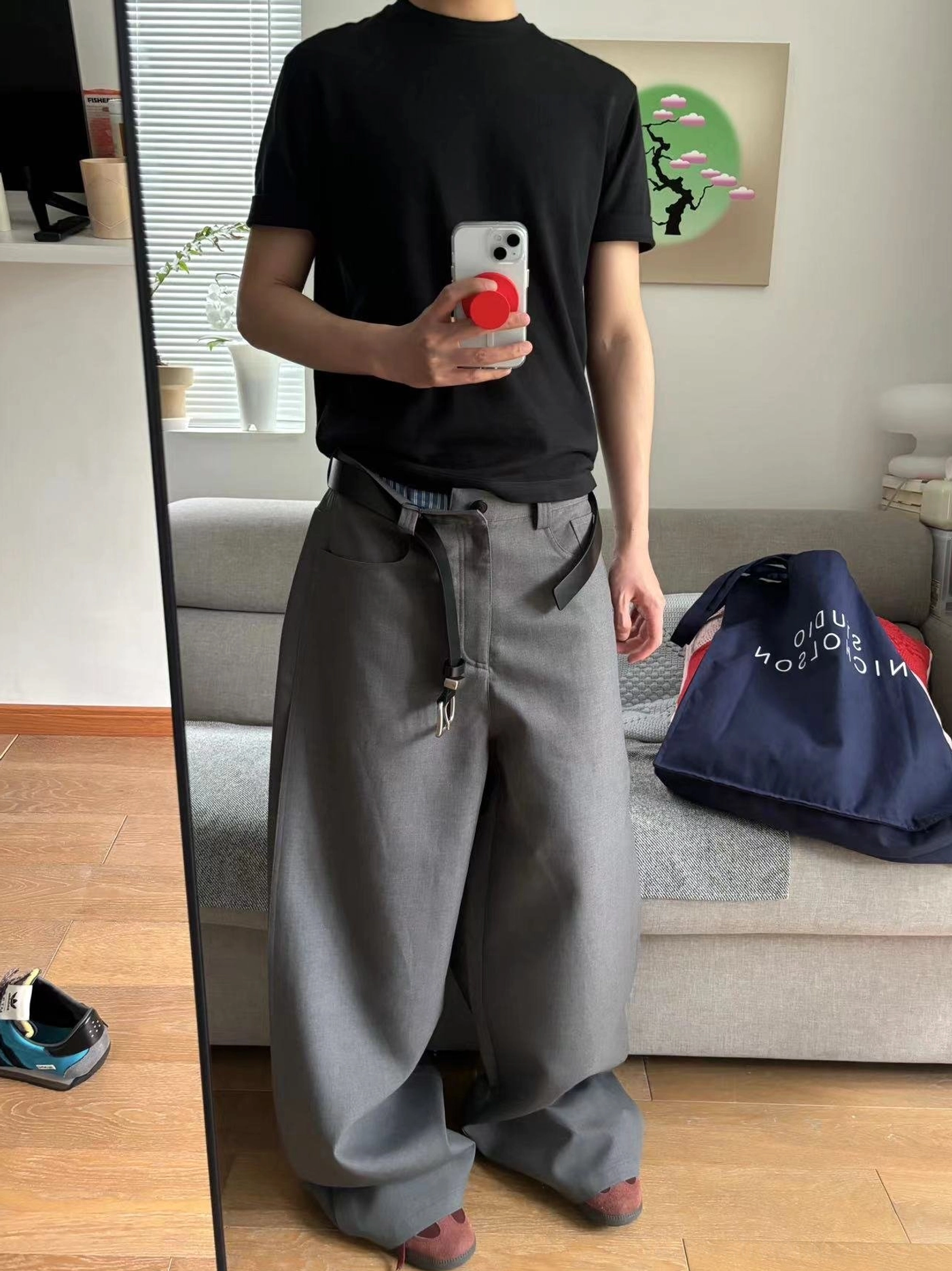 Gray relaxed wide-leg trousers shown in a full-body mirror outfit with an oversized casual top and modern Korean street style proportions