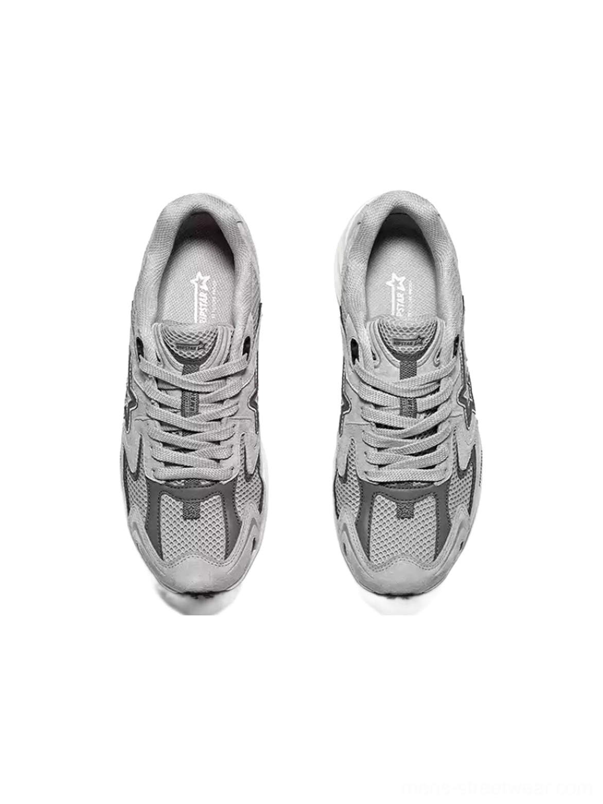 Top view of gray streetwear running sneakers with lace-up closure, breathable mesh panels, suede overlays, and branded insole