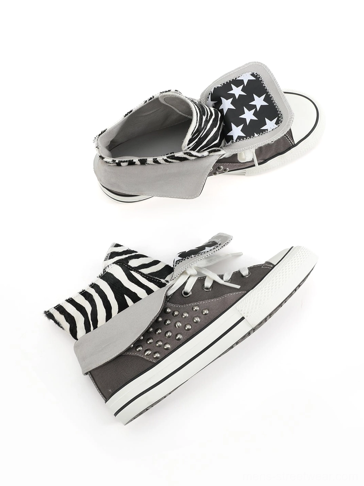 Disassembled view of gray studded high-top sneakers showing zebra print and star print foldable collars, canvas panels, and metal side studs