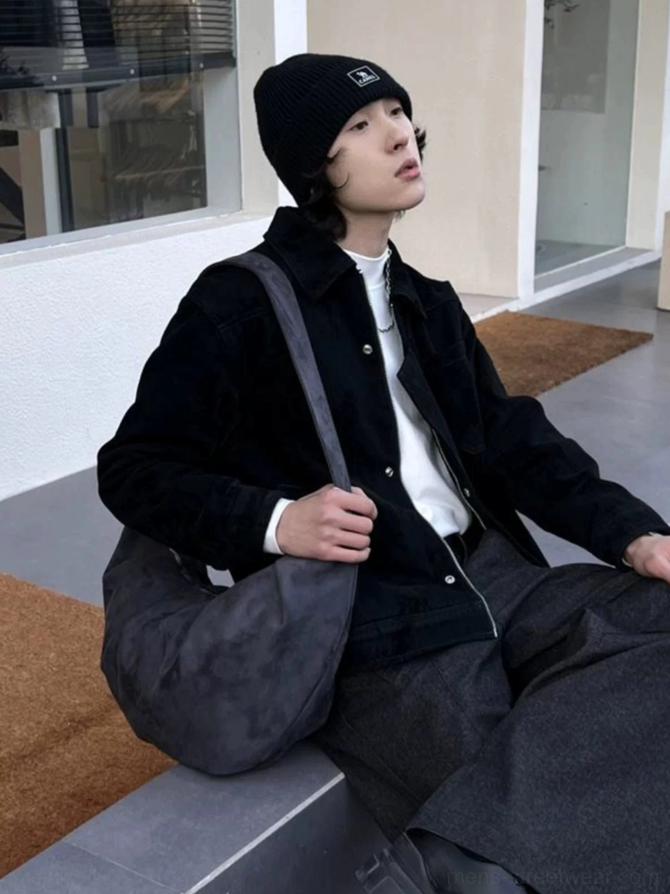 Gray suede-look crescent shoulder bag styled with black jacket and white shirt in Korean streetwear outfit