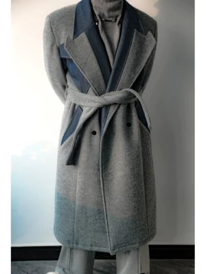Full front view of gray long double-breasted two-tone overcoat styled with gray wide-leg trousers and dark navy contrast lapels
