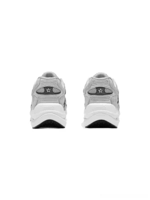 Rear view of gray unisex running sneakers showing star heel tabs, layered suede mesh construction, and thick white gray trimmed sole