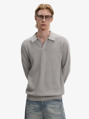 Gray waffle knit Johnny collar long sleeve polo sweater styled with washed blue wide-leg denim in a minimalist studio streetwear look