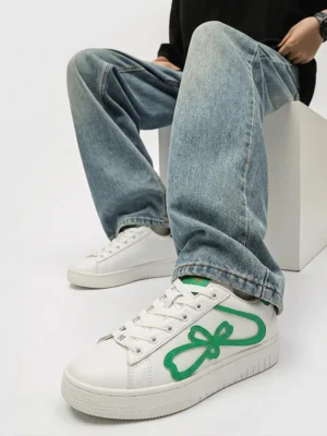 Green clover bow platform sneakers worn with loose blue denim in a Korean streetwear casual outfit