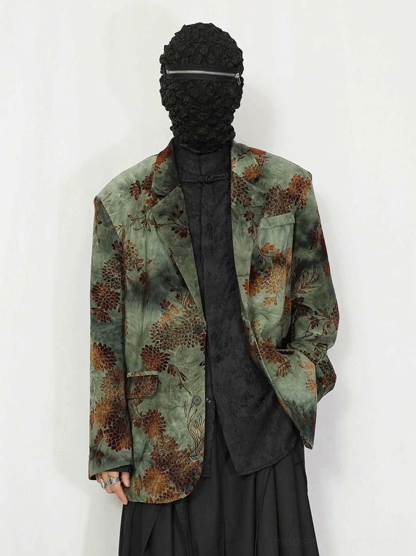 Low-angle front view of green floral jacquard oversized vintage blazer with rust botanical motifs