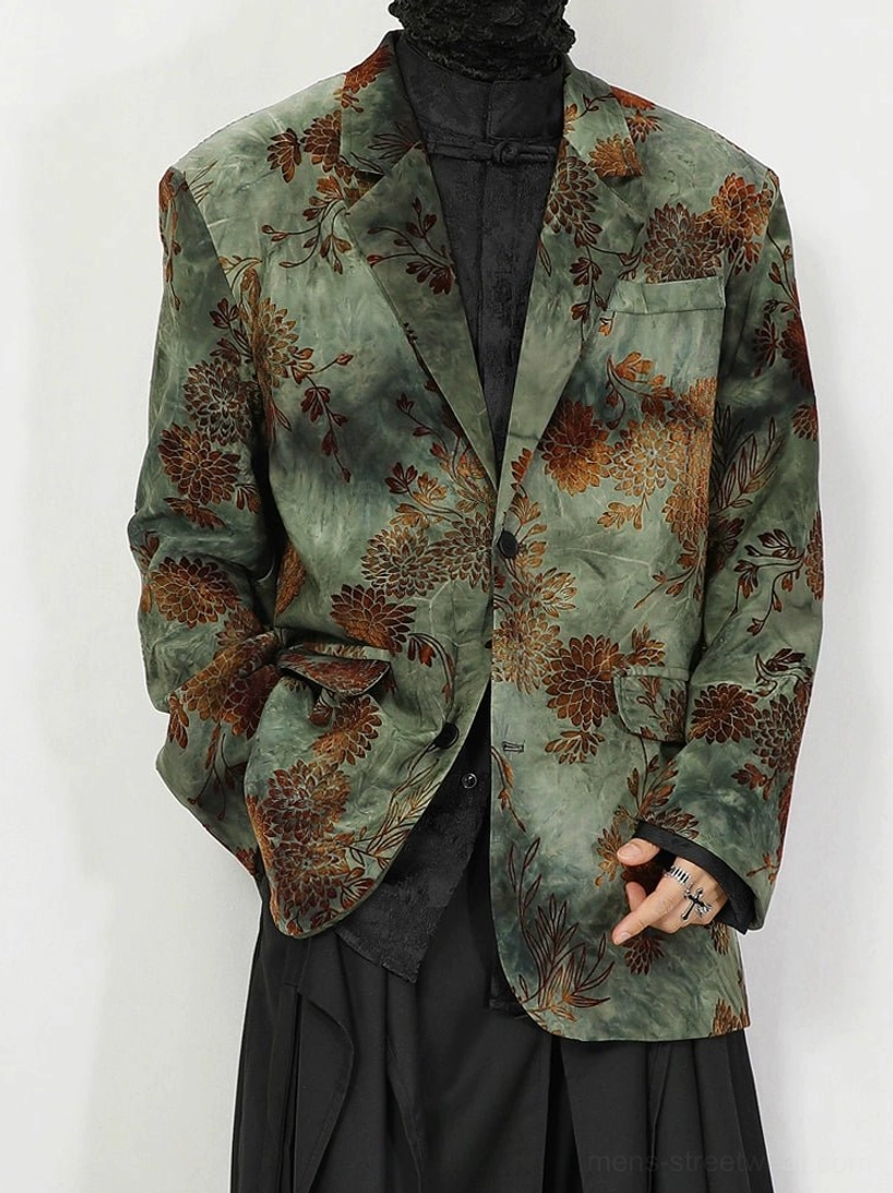 Green floral jacquard oversized vintage blazer worn open over black layered outfit in white studio