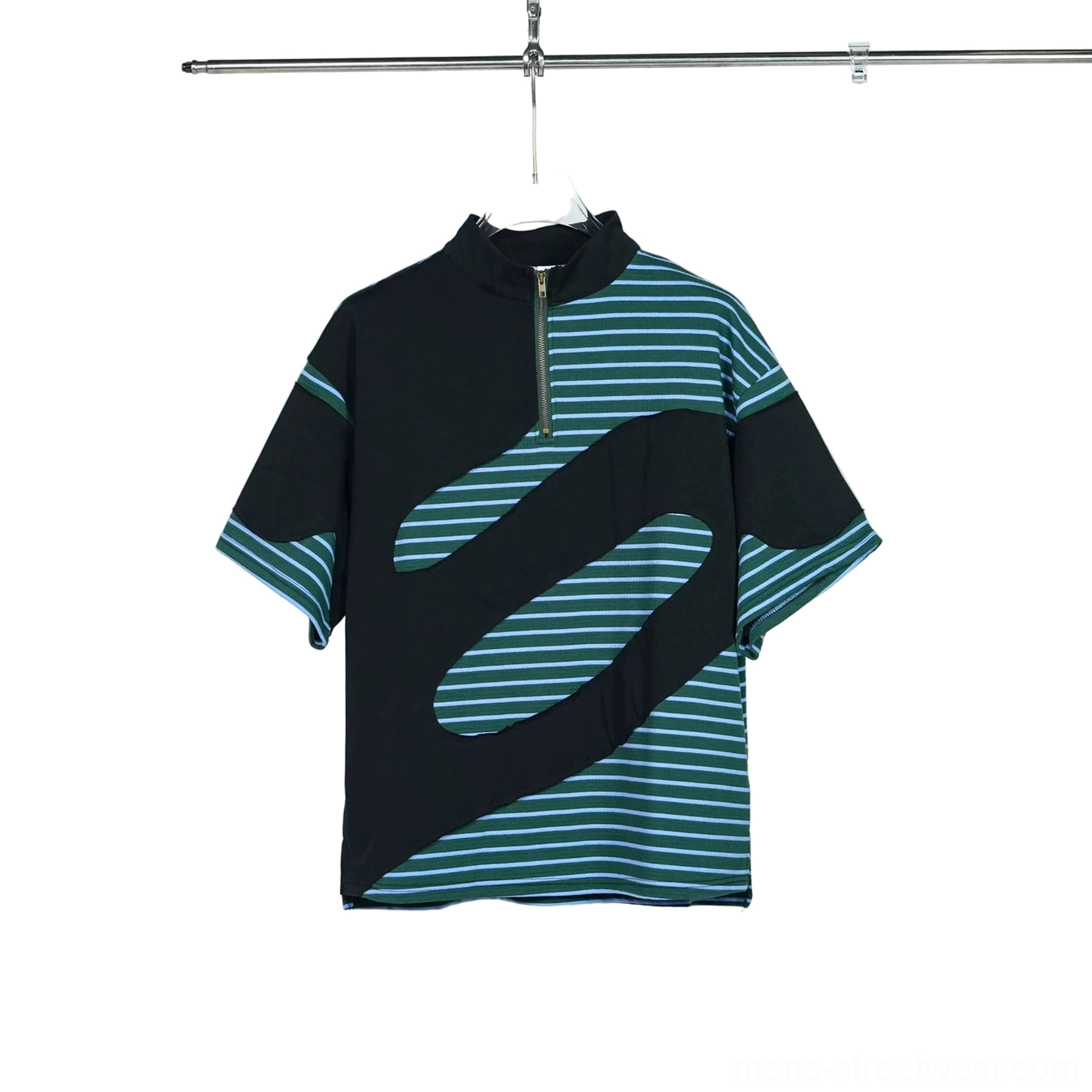 Flat lay front view of a green half-zip striped streetwear tee on a hanger, showing the mock neck zipper, teal wave stripes, black panels, and relaxed silhouette
