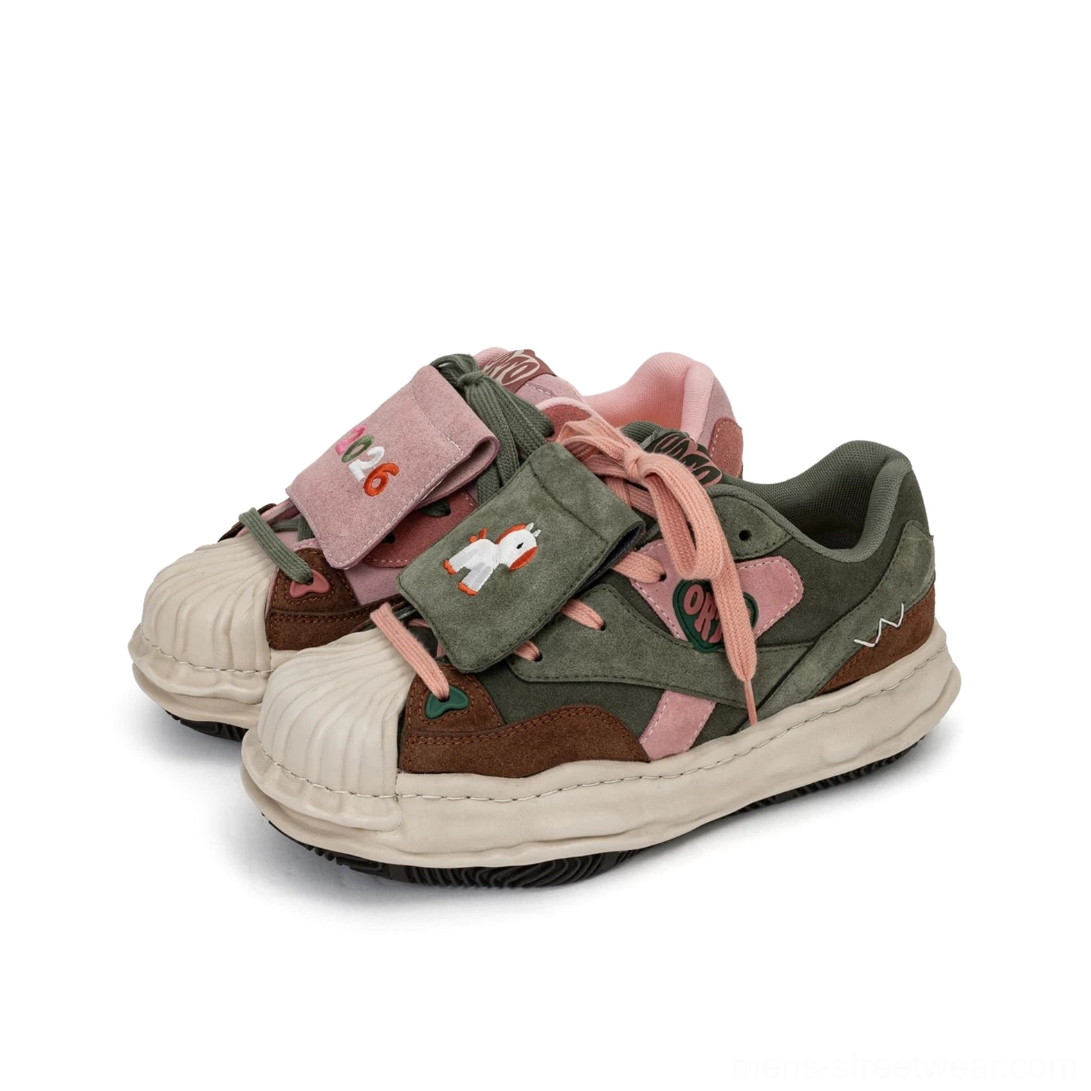 Three-quarter product view of green and pink color-blocked shell-toe sneakers with horse embroidery velcro patch and 2026 tag