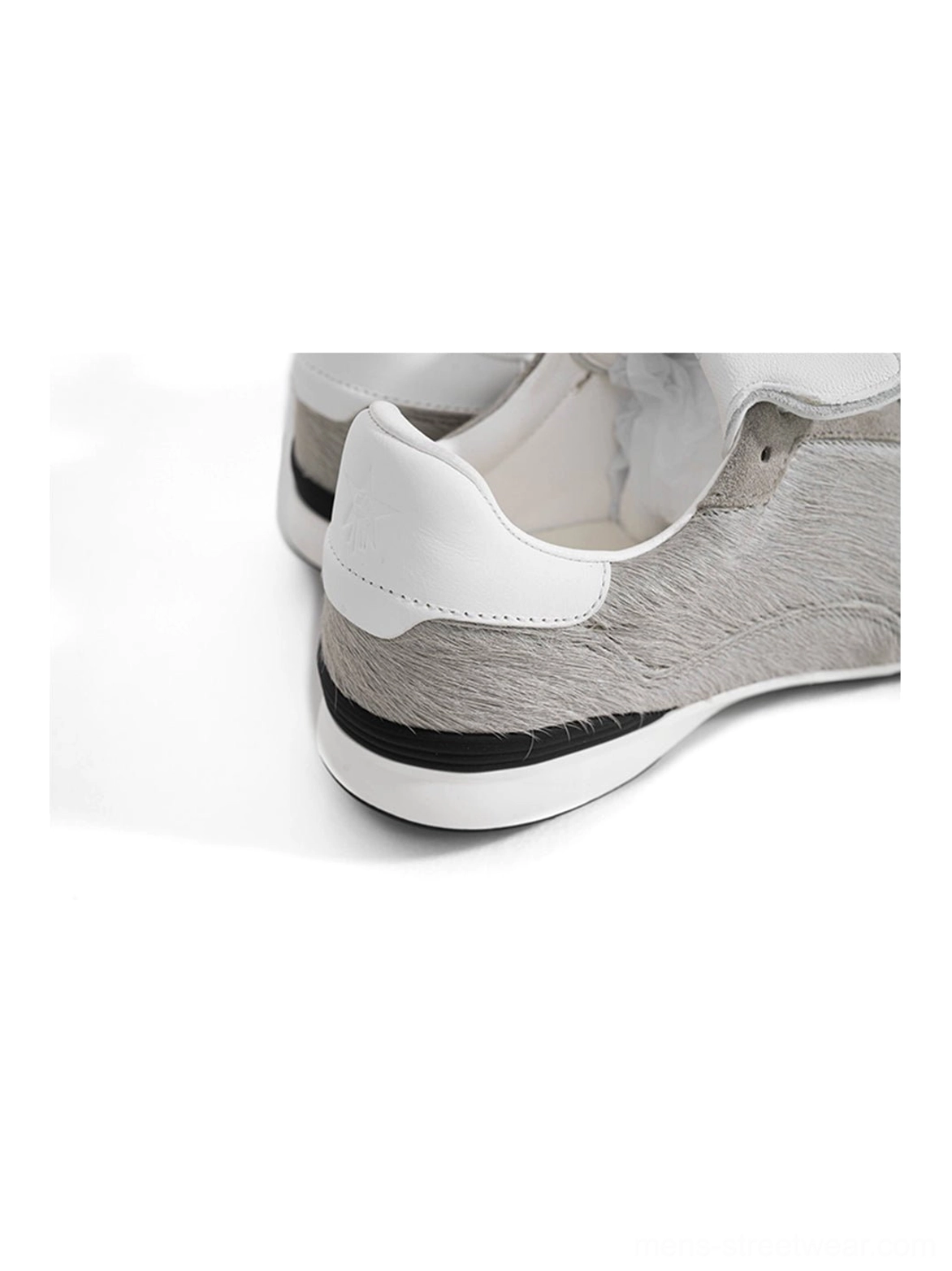 Rear close-up of grey fur-lined platform sneakers showing the soft interior lining, white heel counter, and layered chunky midsole