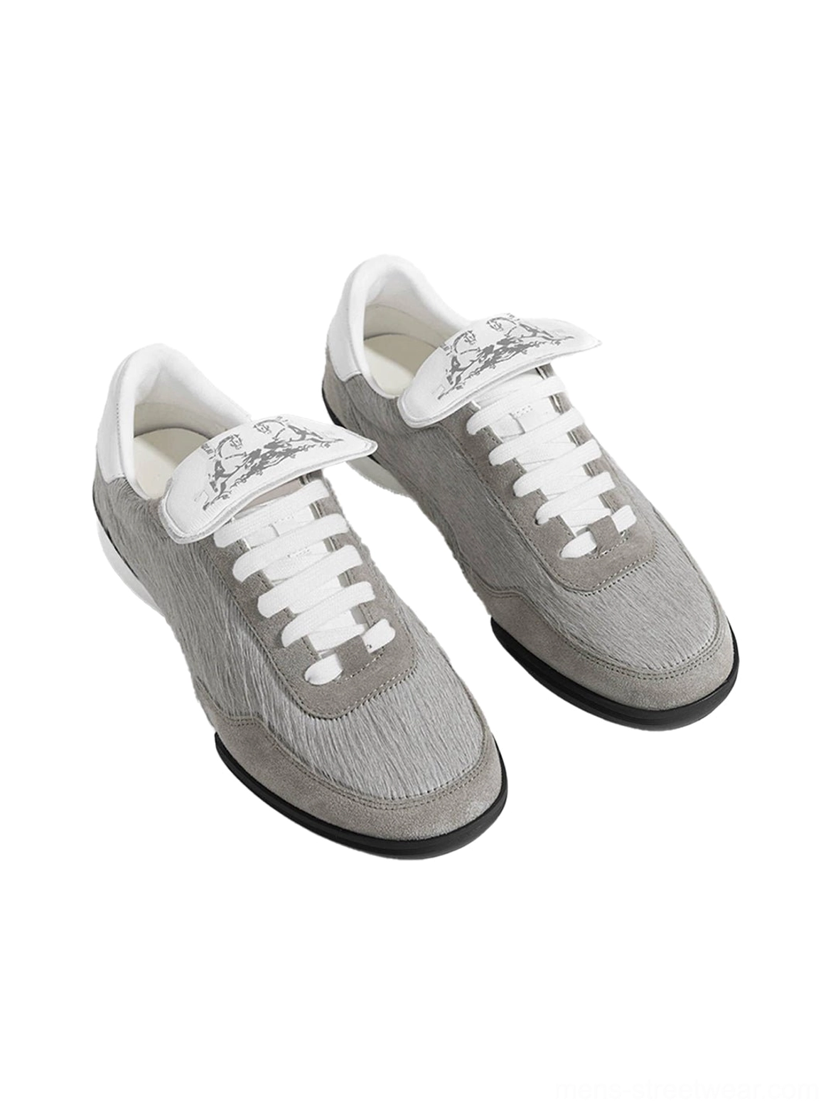 Pair of grey fur-lined platform sneakers shown from above with fuzzy uppers, white laces, decorative printed tongues, and chunky black soles