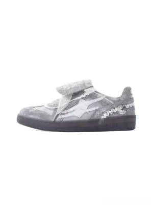 Grey lace-wrapped retro trainer sneakers side profile with washed textured upper, graphic tongue and dark rubber sole