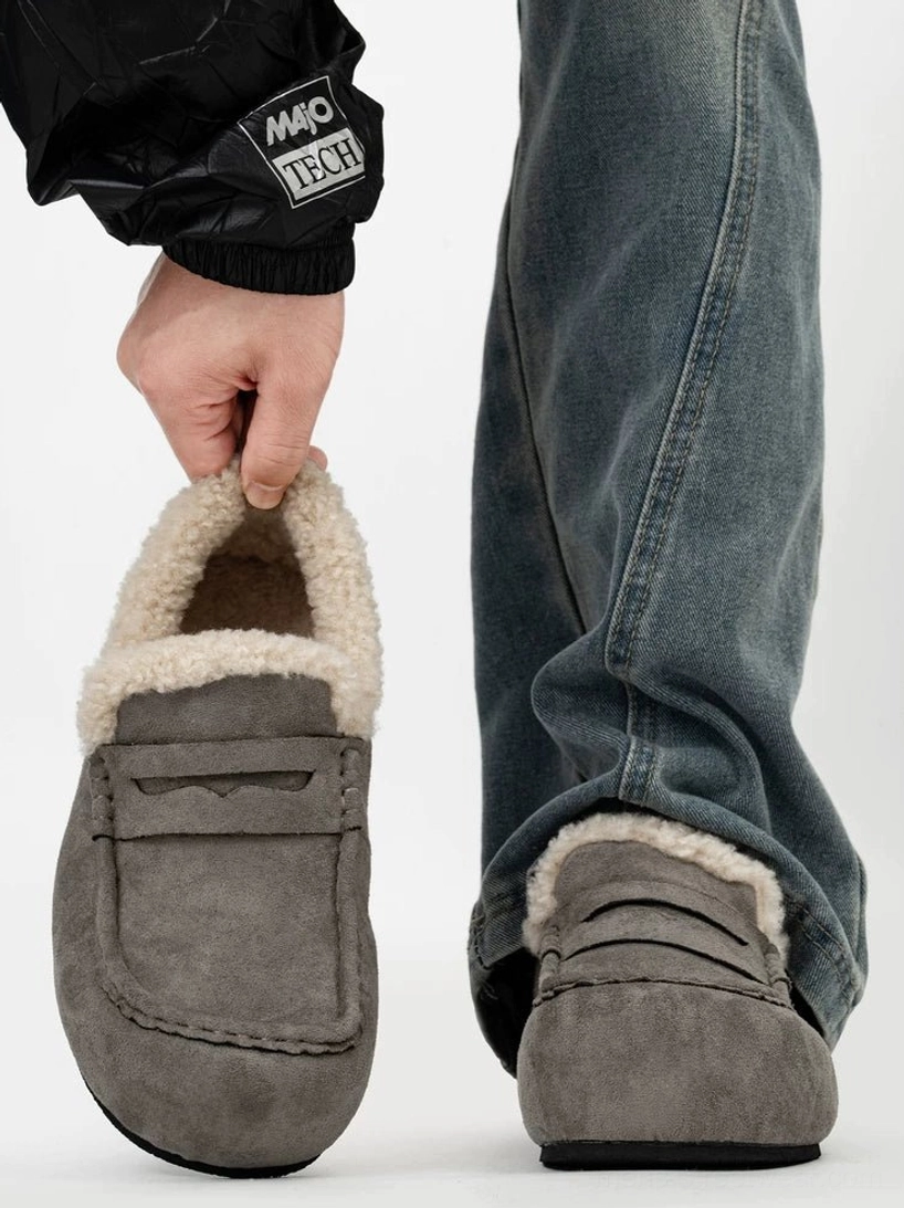 Grey suede finish shearling lined penny loafers shown from front and rear with relaxed blue jeans